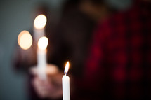 People holding candles for a candlelight service