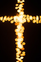 bokeh Christmas lights in the shape of a cross 
