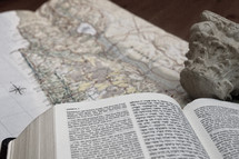 Hebrew - English Bible on top of a map of Israel.