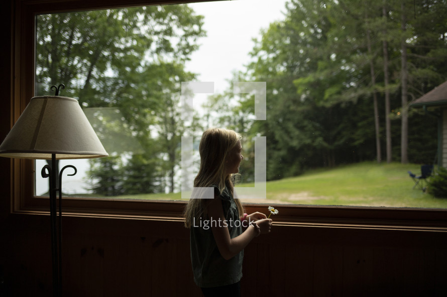 a child looking out a window 