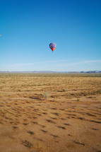 hot air balloon over desert