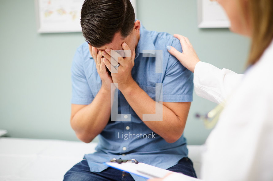 a man at the doctor's office getting bad news