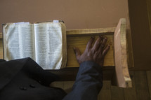 preacher at the pulpit with an open Bible