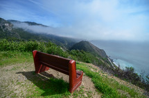 bench on mountaintop overlooking the ocean 