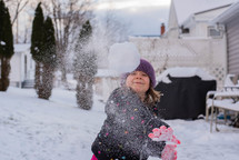  a child playing in snow 
