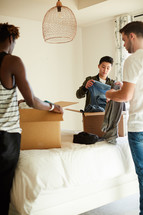teens packing moving boxes 