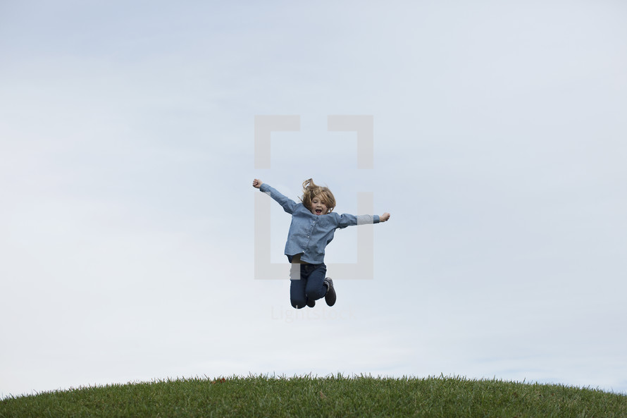 a girl leaping in the air 