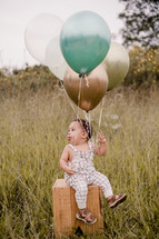 toddler and balloons portrait 