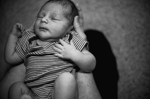 newborn in father's hands