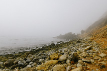 fog over a rocky shore 
