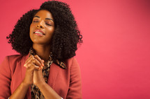 African American woman with praying hands 