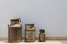 old rusty milk cans 