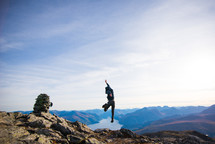man jumping on a mountainside 