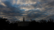 silhouette of a steeple at dusk 