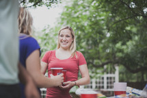friends in conversation at a cookout 