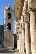 A stone bell tower and columns in Cathedral square