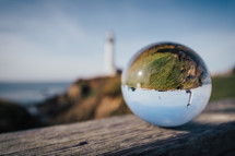 glass orb with lighthouse view 