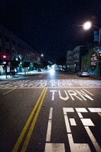 turn lane on a downtown street at night 