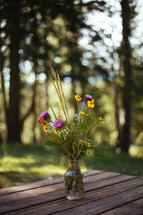 wildflowers in a vase on a table 