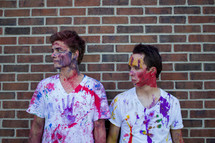 teen boys covered in paint 