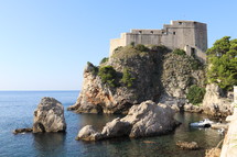 fortress walls along a shore 