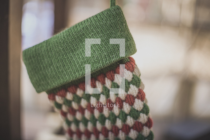 A red and green stocking hanging