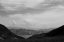 power lines and mountains and lake 