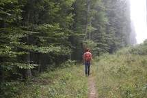 man hiking on a trail 