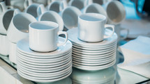 stacked plates and mugs 