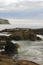 sea rocks and calm water 