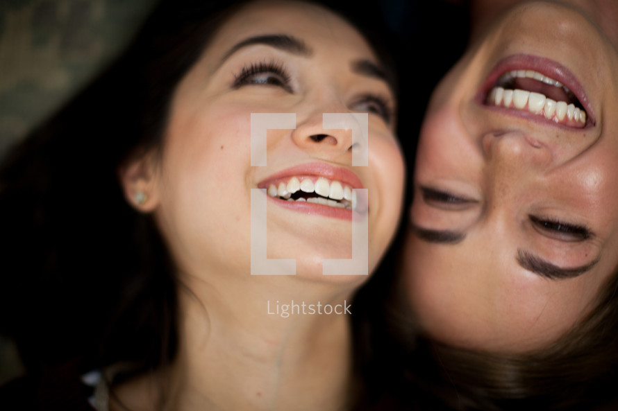 faces of happy, smiling women 