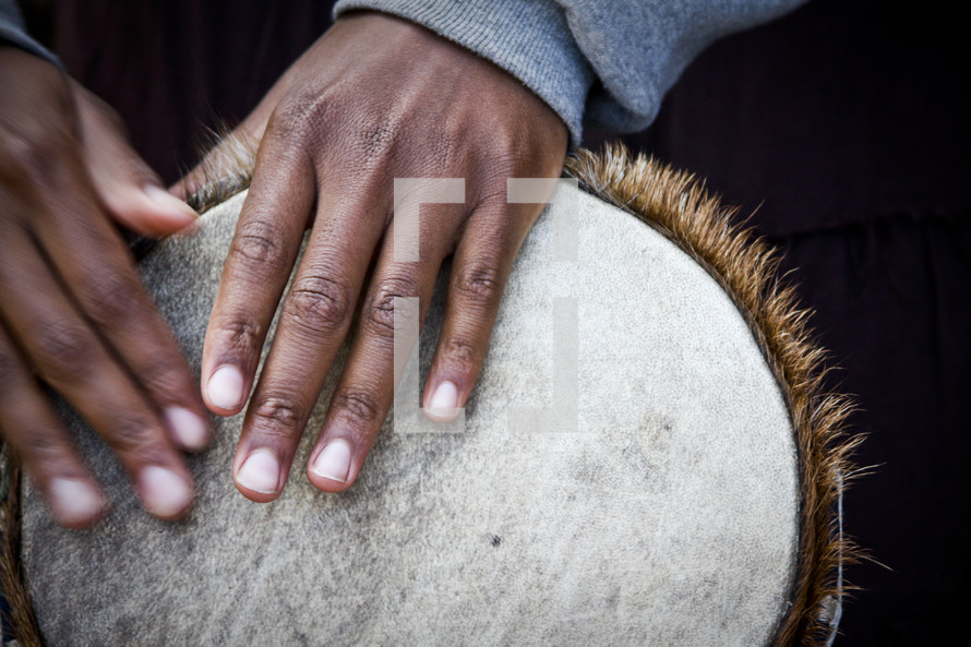 Man playing African drum