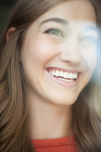 a woman's smiling face 