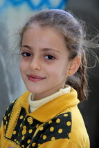 A smiling Chaldean Christian girl from a refugee camp in northern Iraq. [For similar search Ethnic Smile Face]. 