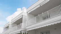Balcony house with white railing