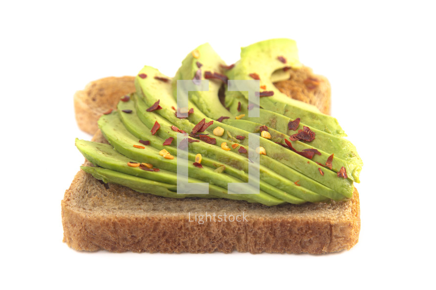 Hot and Spicy Avocado Toast with Toppings Isolated on a White Background