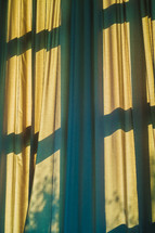 cross shadows on curtains 