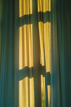 cross shadow on curtains 