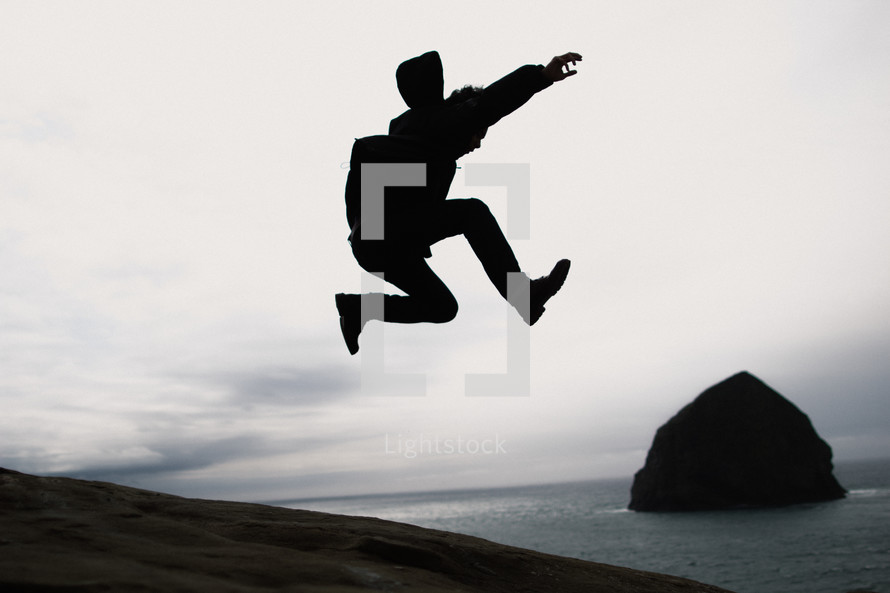 silhouette of a man leaping 
