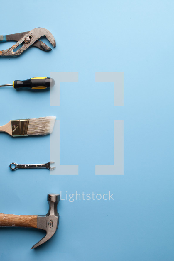 Tools lined up on the left side of a blue background.