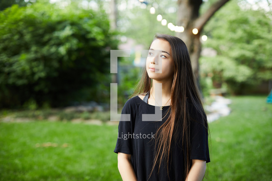 teen girl looking up to God 