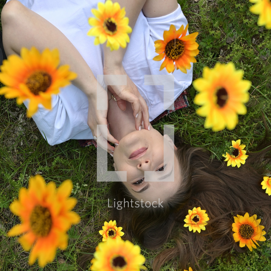 Portrait Of A Happy Girl With Flowers In Her Hair on Field