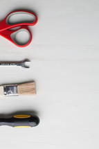 Tools lined up on the left side of a white background.