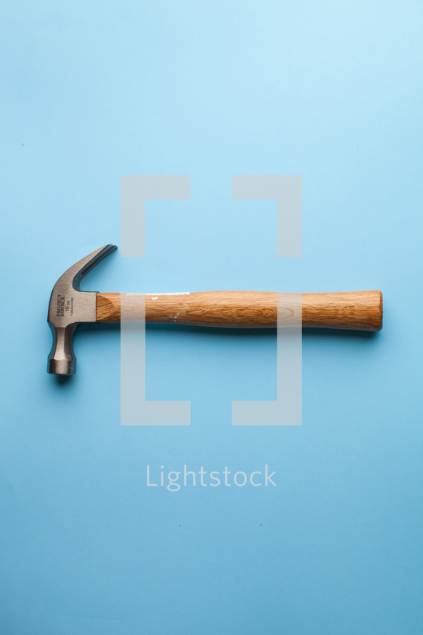 A hammer on a blue background.