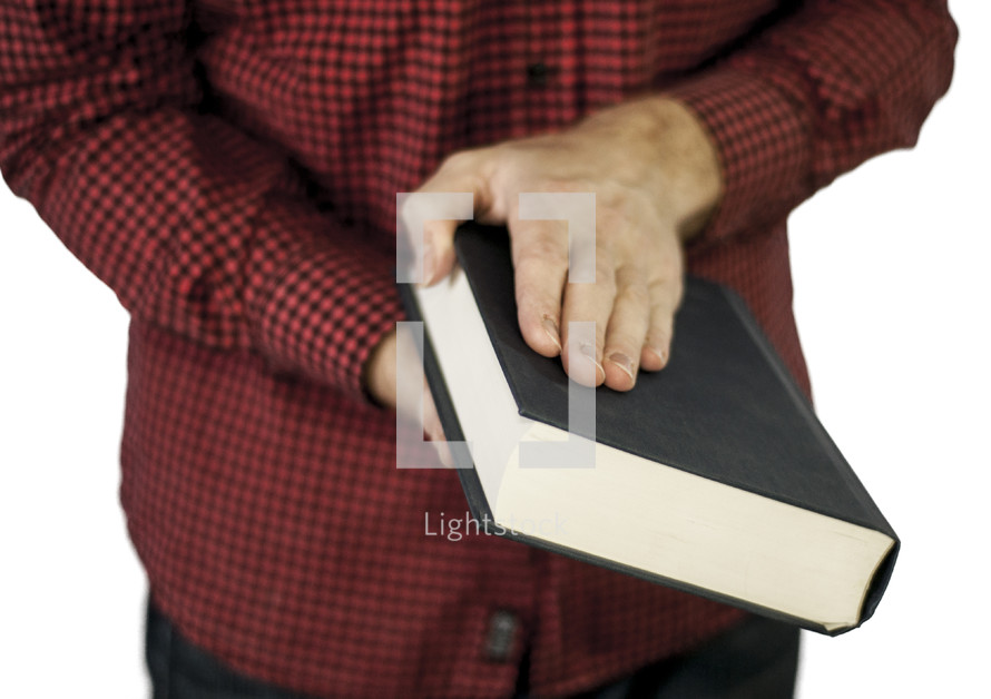 a man opening a Bible 