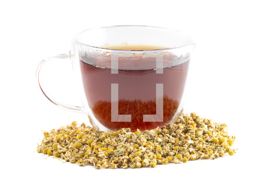 Hot Chamomile Tea with Dried Chamomile Flowers Isolated on a White Background