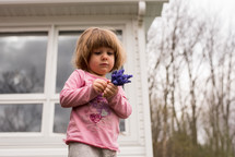 toddler girl picking flowers 