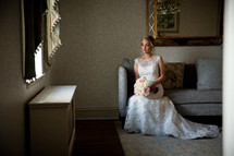 bride sitting on a couch waiting 