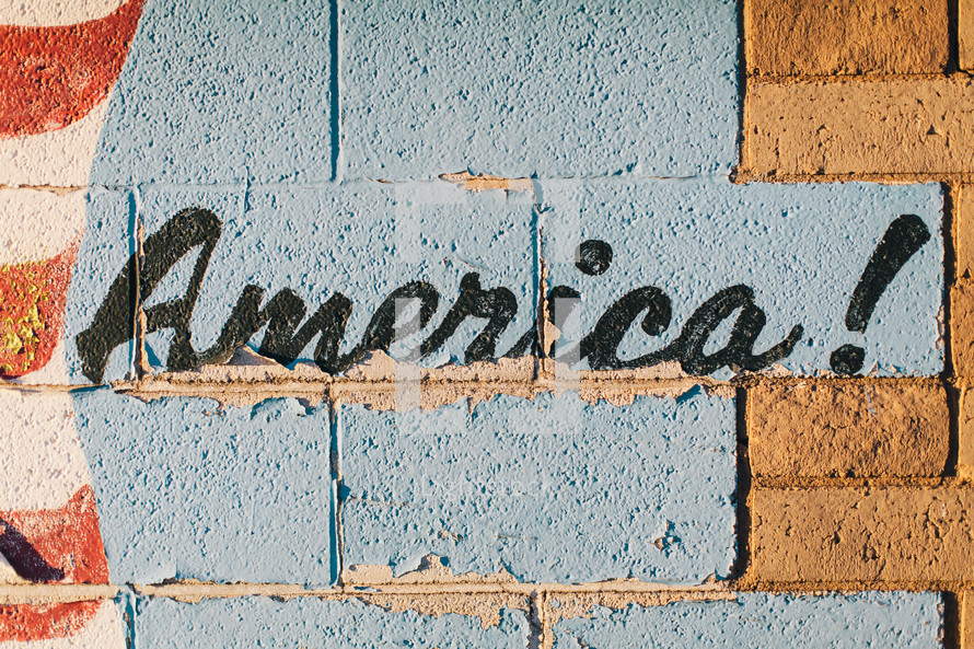 word America painting on a brick wall 