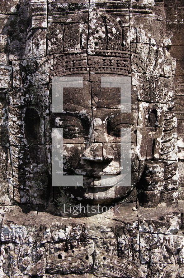 Buddhist sculpture in towers of Bayon temple. Angkor Wat.